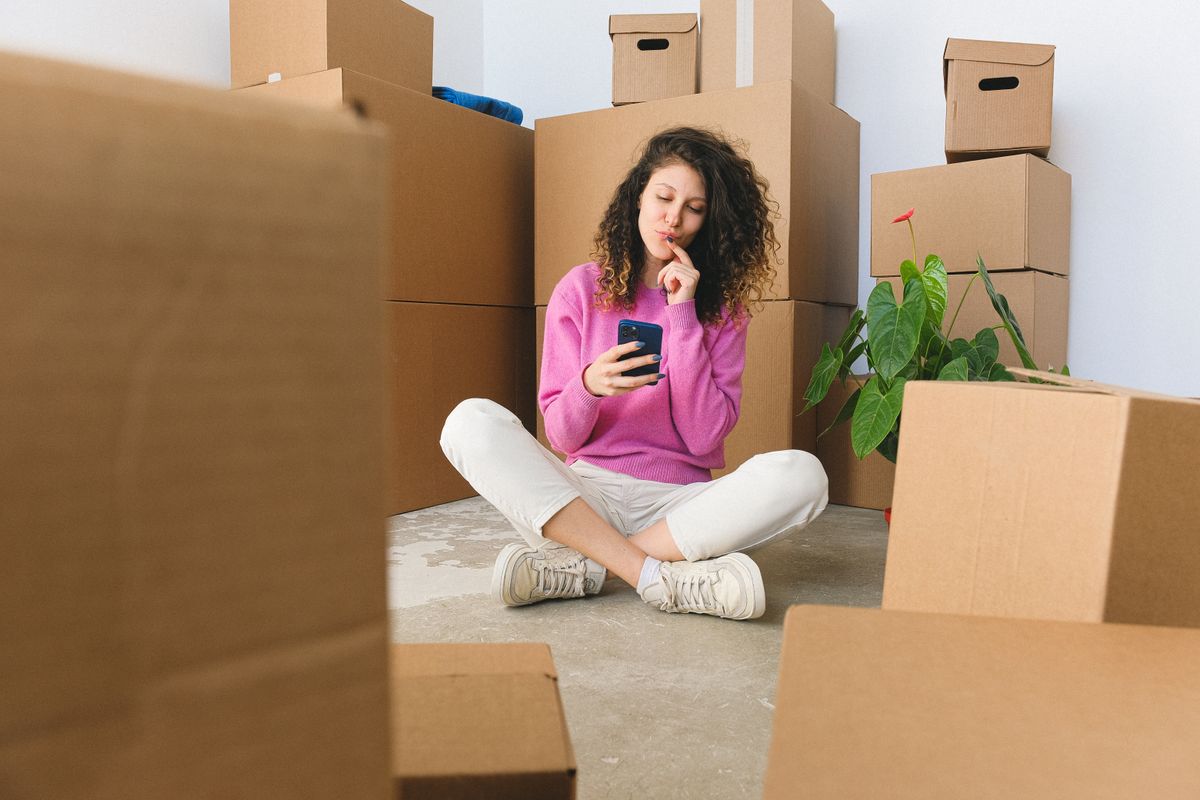 Person messaging on a phone to enquire about a room